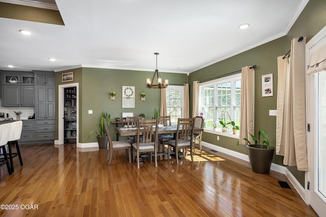 8740 County Road 241, Webb City, MO 64870 - dining area featuring baseboards, light wood-type flooring, a chandelier, crown molding, and recessed lighting