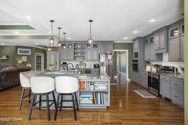 8740 County Road 241, Webb City, MO 64870 - kitchen featuring appliances with stainless steel finishes, gray cabinets, open floor plan, ornamental molding, and a spacious island