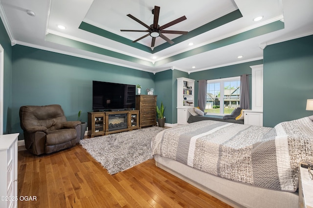 8740 County Road 241, Webb City, MO 64870 - bedroom with ornamental molding, wood finished floors, a raised ceiling, baseboards, and ceiling fan