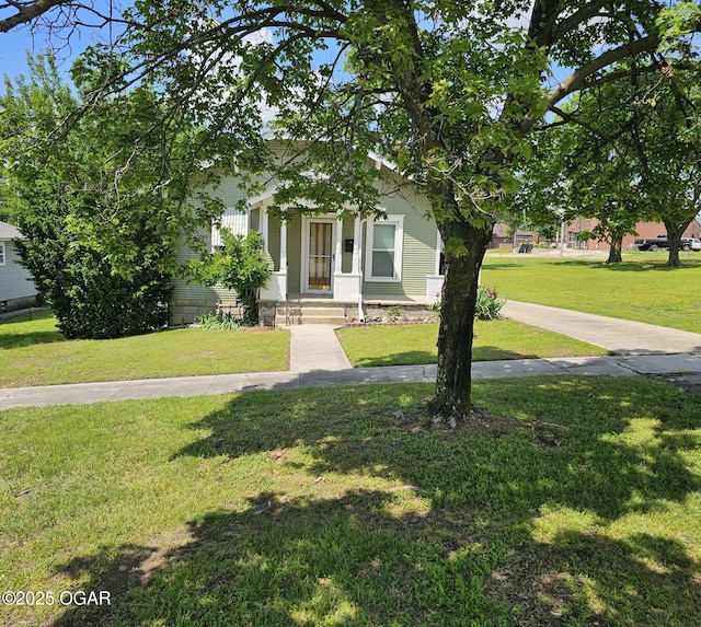 obstructed view of property featuring a front yard