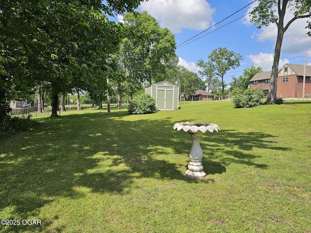 view of green lawn with a shed and an outdoor structure