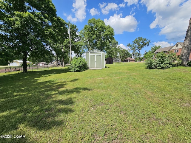 view of yard featuring a shed and an outbuilding