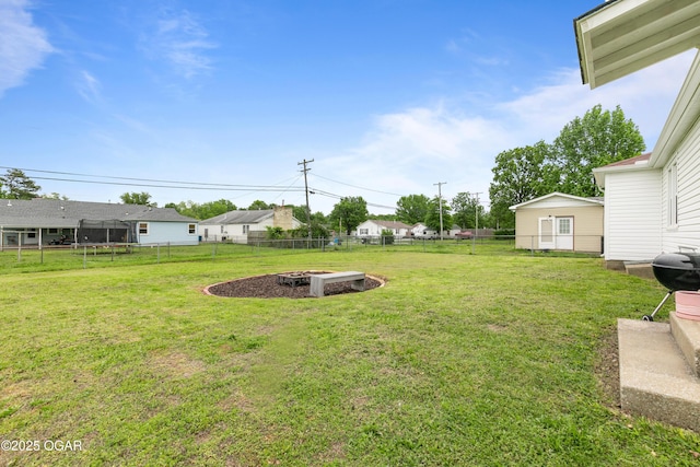 view of yard with an outdoor fire pit
