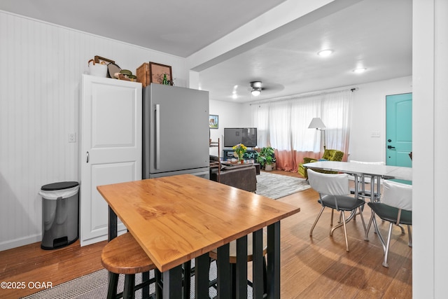 kitchen with wood finished floors and freestanding refrigerator