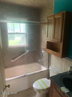 426 N Jackson Ave, Joplin, MO 64801 - bathroom featuring tub / shower combination, toilet, and vanity