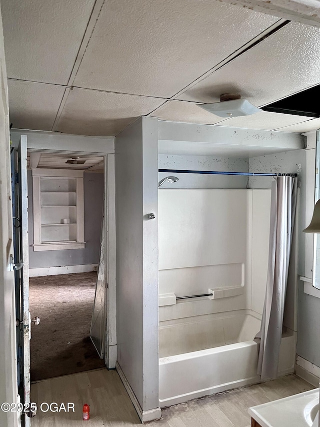 210 W 4th St, Webb City, MO 64870 - bathroom with wood finished floors and shower / tub combo