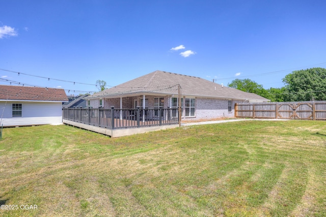 1020 S Florida Ave, Joplin, MO 64801 - rear view of house featuring brick siding and a wooden deck