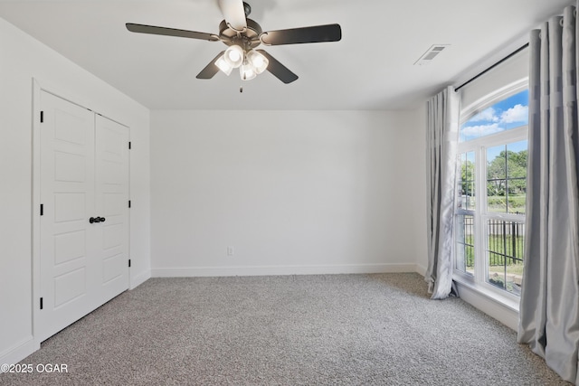 1020 S Florida Ave, Joplin, MO 64801 - unfurnished bedroom with multiple windows, carpet flooring, and baseboards