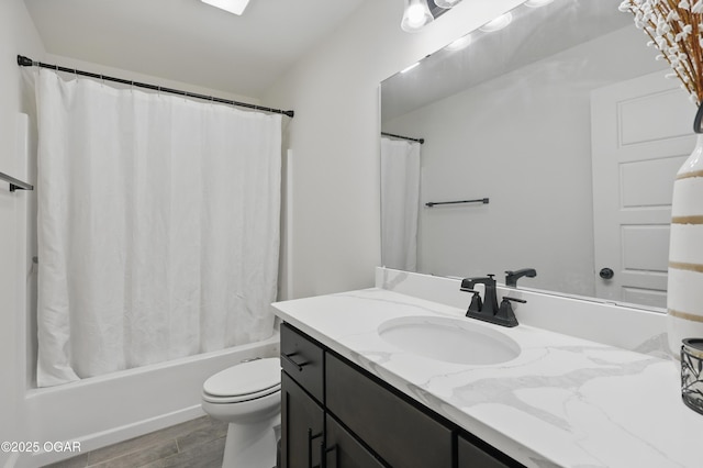 1020 S Florida Ave, Joplin, MO 64801 - bathroom with vanity, shower / tub combo with curtain, toilet, and wood finished floors