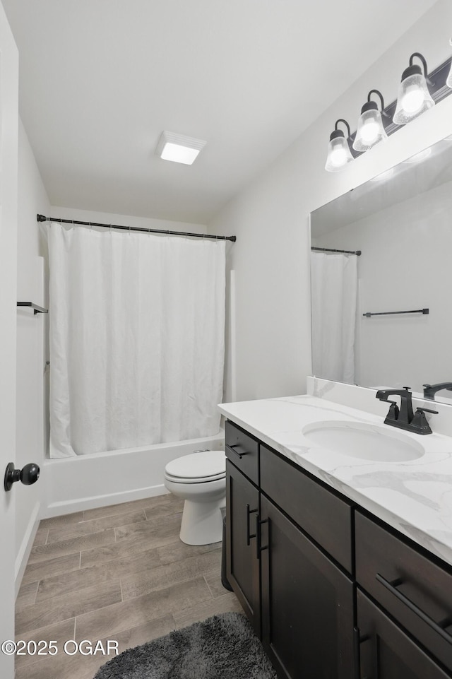 1020 S Florida Ave, Joplin, MO 64801 - full bathroom featuring toilet, vanity, wood finished floors, and shower / bath combination with curtain
