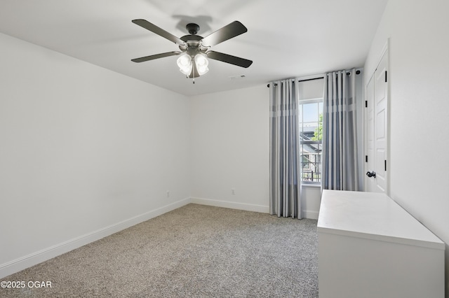 1020 S Florida Ave, Joplin, MO 64801 - unfurnished room featuring baseboards, light colored carpet, and a ceiling fan