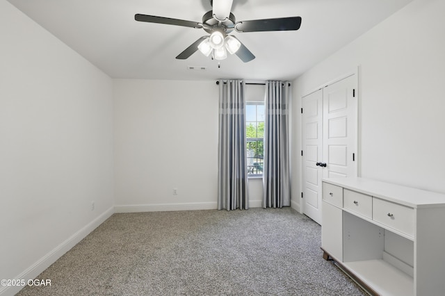 1020 S Florida Ave, Joplin, MO 64801 - unfurnished bedroom featuring light colored carpet, baseboards, and a ceiling fan