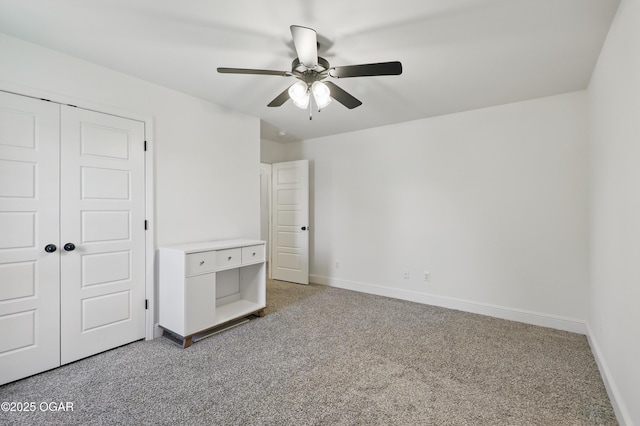 1020 S Florida Ave, Joplin, MO 64801 - unfurnished bedroom featuring baseboards, light colored carpet, a closet, and a ceiling fan