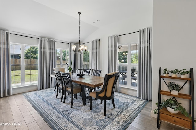 1020 S Florida Ave, Joplin, MO 64801 - dining space with vaulted ceiling, plenty of natural light, a chandelier, and light wood-style flooring
