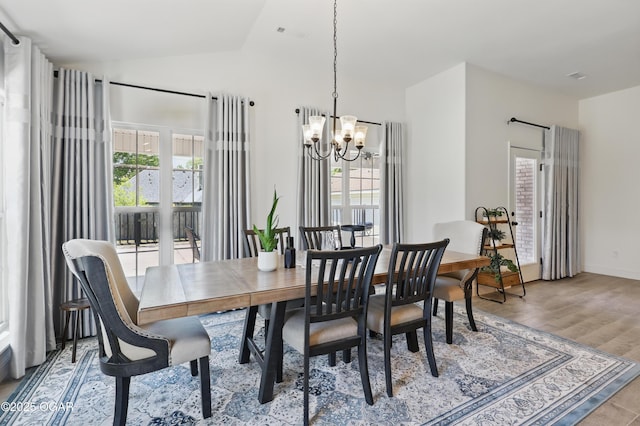 1020 S Florida Ave, Joplin, MO 64801 - dining space with a chandelier, lofted ceiling, and light wood-type flooring