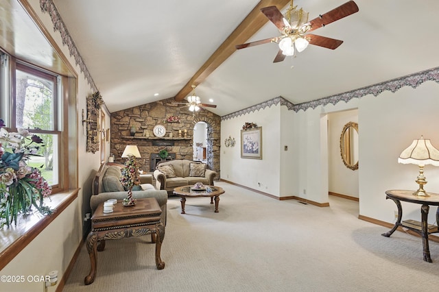 living area featuring a ceiling fan, carpet flooring, baseboards, and a fireplace