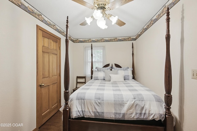 bedroom with dark wood-style flooring and ceiling fan