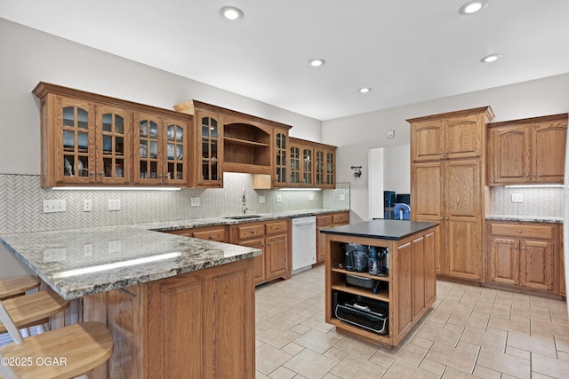 10208 Timberline Cir, Joplin, MO 64804 - kitchen featuring dishwasher, open shelves, a sink, a peninsula, and recessed lighting