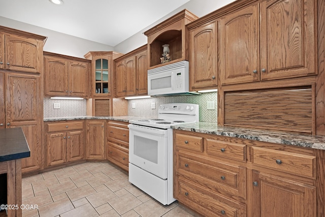 10208 Timberline Cir, Joplin, MO 64804 - kitchen with white appliances, backsplash, brown cabinets, and light stone counters