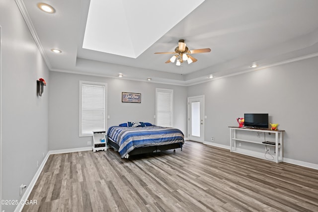 10208 Timberline Cir, Joplin, MO 64804 - bedroom with a tray ceiling, wood finished floors, baseboards, recessed lighting, and crown molding