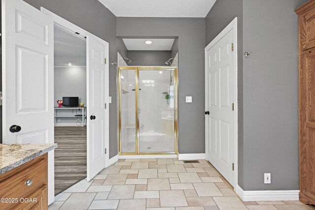 10208 Timberline Cir, Joplin, MO 64804 - full bathroom featuring baseboards, a shower stall, and vanity