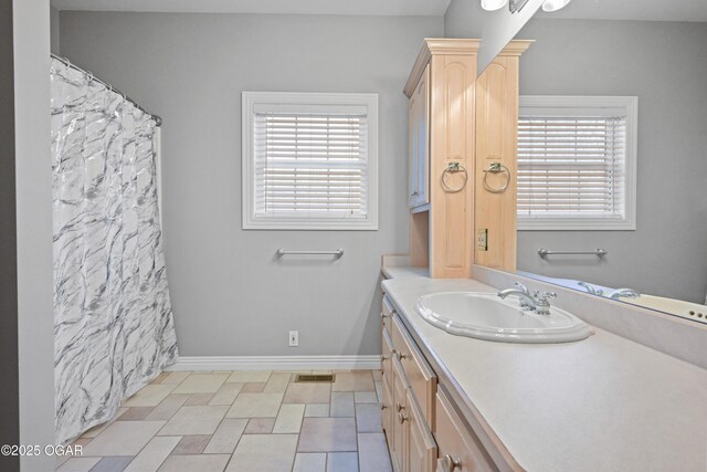 10208 Timberline Cir, Joplin, MO 64804 - bathroom with vanity and baseboards
