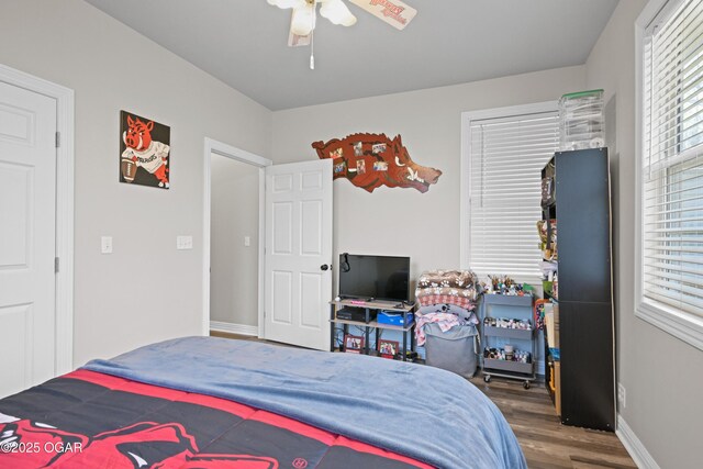 10208 Timberline Cir, Joplin, MO 64804 - bedroom featuring wood finished floors, baseboards, and ceiling fan