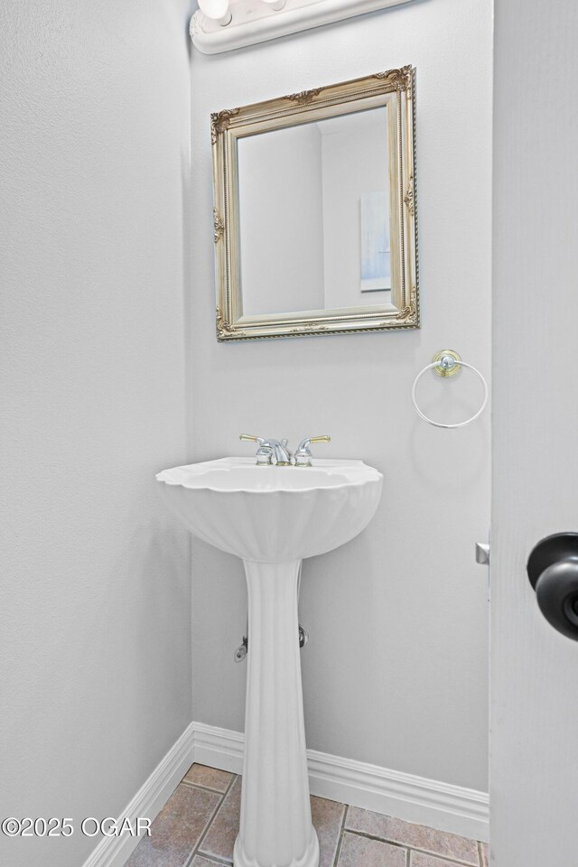 10208 Timberline Cir, Joplin, MO 64804 - bathroom with baseboards and tile patterned flooring