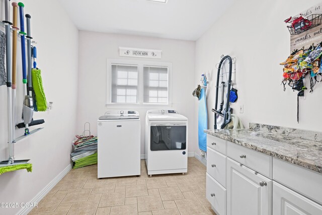 10208 Timberline Cir, Joplin, MO 64804 - clothes washing area with washing machine and dryer, cabinet space, and baseboards
