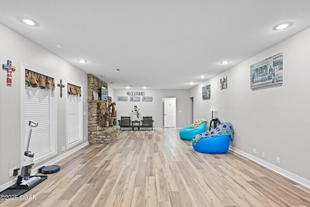 10208 Timberline Cir, Joplin, MO 64804 - exercise room featuring wood finished floors, baseboards, and recessed lighting