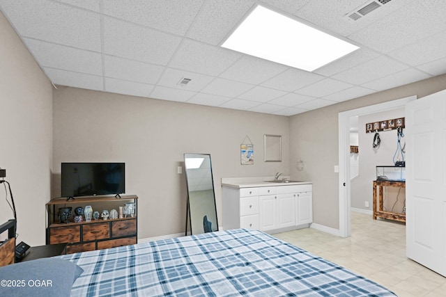 10208 Timberline Cir, Joplin, MO 64804 - bedroom with a sink, a drop ceiling, and baseboards
