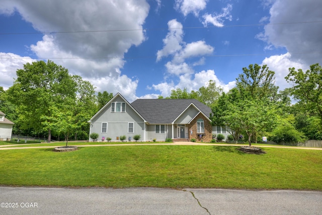 10208 Timberline Cir, Joplin, MO 64804 - view of front of house featuring a front lawn, board and batten siding, roof with shingles, and brick siding