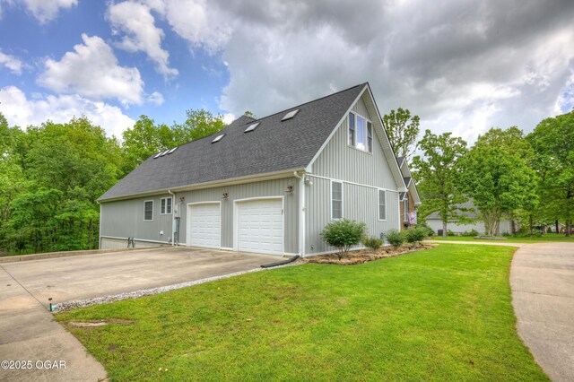 10208 Timberline Cir, Joplin, MO 64804 - view of home's exterior featuring asphalt driveway, a shingled roof, a lawn, and a garage
