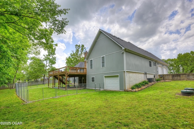 10208 Timberline Cir, Joplin, MO 64804 - rear view of house featuring a wooden deck, central air condition unit, stairs, and an attached garage