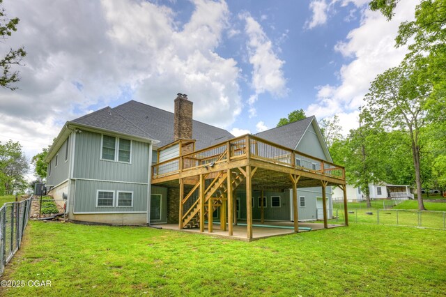 10208 Timberline Cir, Joplin, MO 64804 - rear view of house with a wooden deck, a chimney, a patio, roof with shingles, and stairs