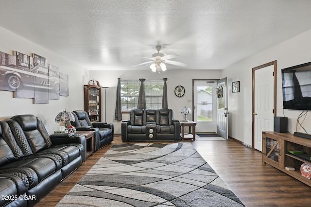 living room with ceiling fan and wood finished floors