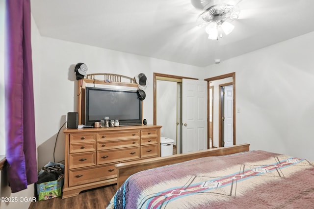 bedroom with dark wood finished floors, a closet, and a ceiling fan
