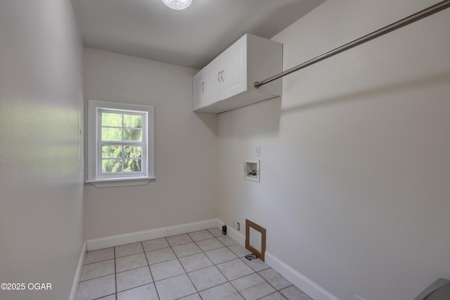 14266 Burr Oak Rd, Carthage, MO 64836 - laundry room featuring cabinet space, baseboards, light tile patterned floors, and washer hookup