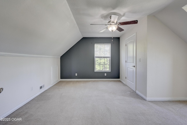 14266 Burr Oak Rd, Carthage, MO 64836 - additional living space featuring vaulted ceiling, carpet floors, ceiling fan, and baseboards