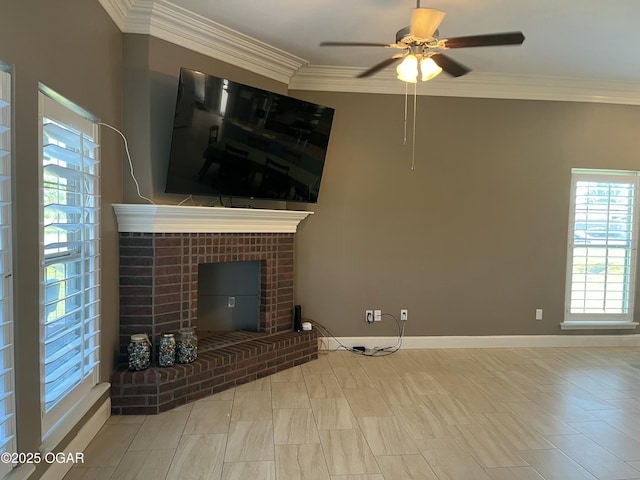 unfurnished living room featuring a ceiling fan, a brick fireplace, crown molding, and baseboards
