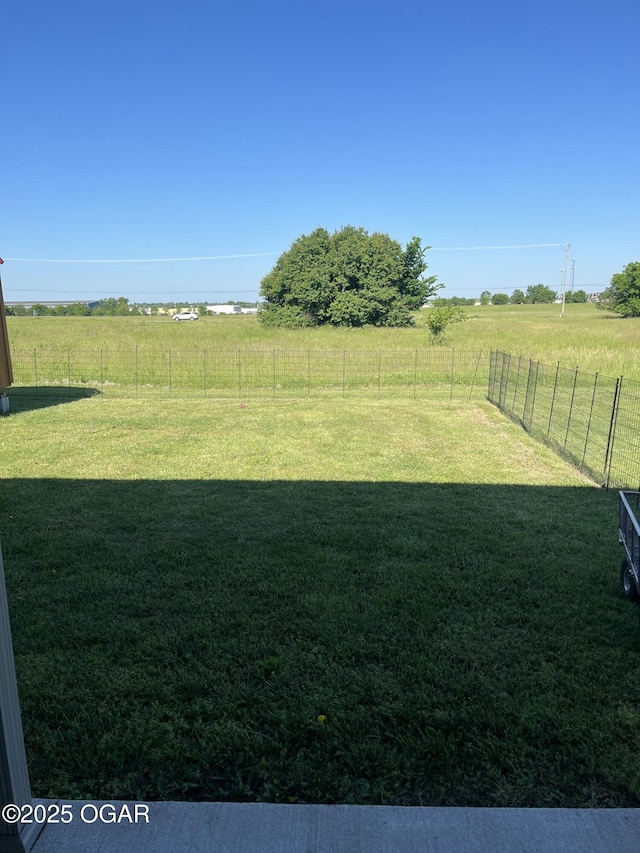 view of yard with a rural view