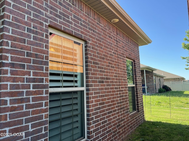 view of home's exterior featuring brick siding