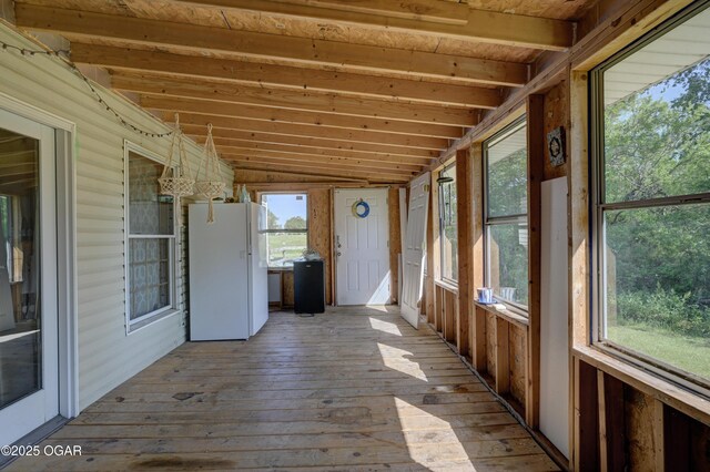 21103 Colt Ln, Diamond, MO 64840 - unfurnished sunroom with lofted ceiling, hardwood / wood-style flooring, and a deck