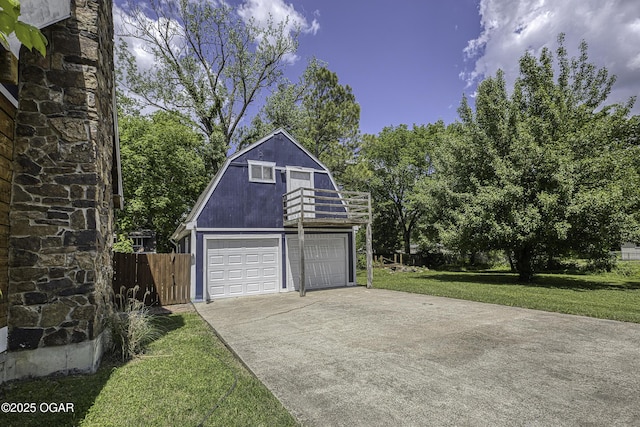 garage with concrete driveway