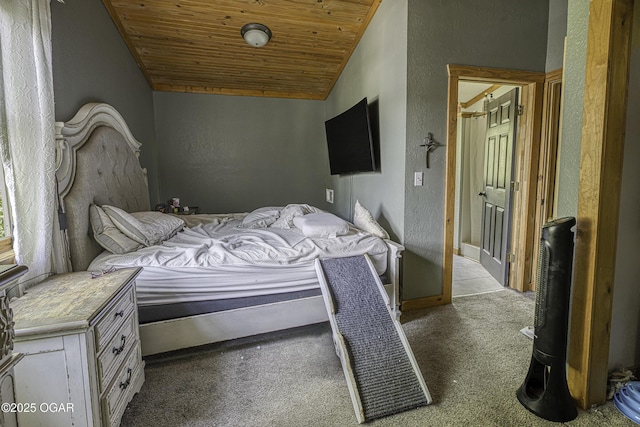 bedroom with wood ceiling, a textured wall, carpet floors, and baseboards