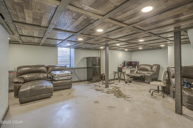 basement featuring freestanding refrigerator
