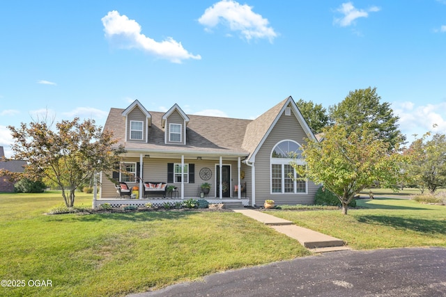 1617 Alexandra Dr, Carthage, MO 64836 - new england style home with covered porch, a front yard, and roof with shingles