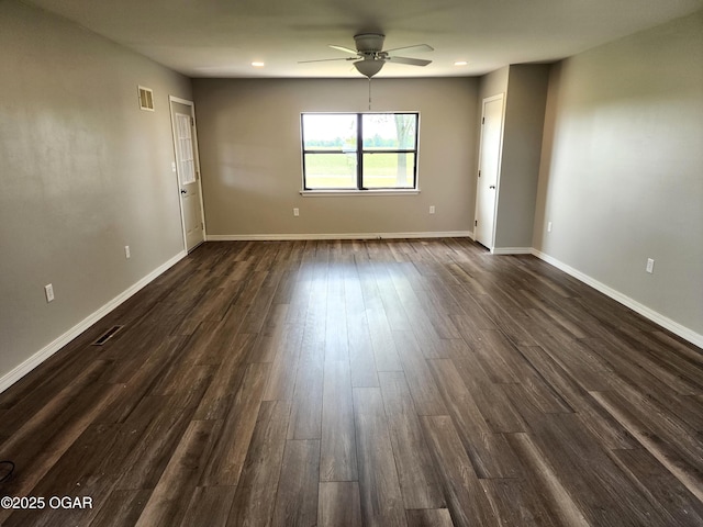 208 NW 10th Rd, Lamar, MO 64759 - empty room featuring ceiling fan, dark wood finished floors, baseboards, and recessed lighting