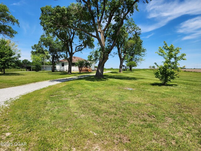 208 NW 10th Rd, Lamar, MO 64759 - view of home's community featuring a yard