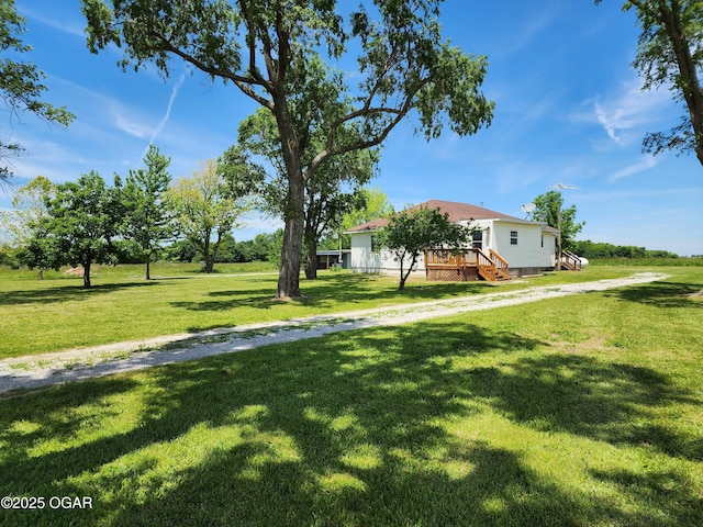208 NW 10th Rd, Lamar, MO 64759 - view of grassy yard with a deck